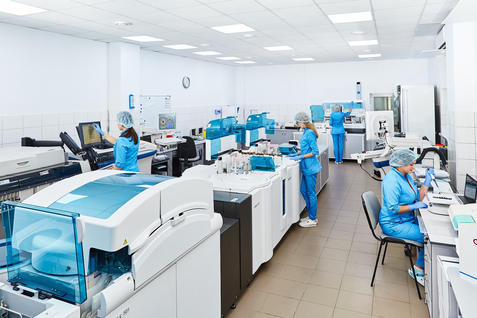 Quality control laboratory technicians testing samples